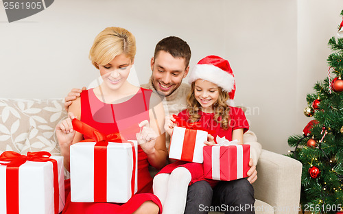 Image of happy family opening gift boxes