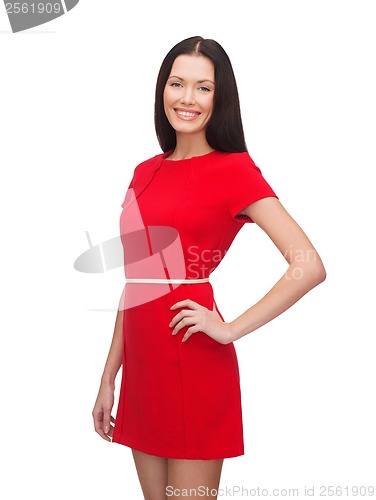 Image of smiling young woman in red dress