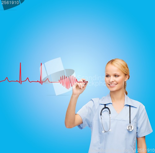 Image of smiling doctor or nurse drawing cardiogram