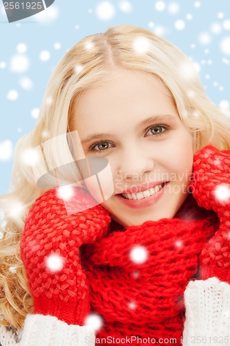 Image of teenage girl in red mittens and scarf