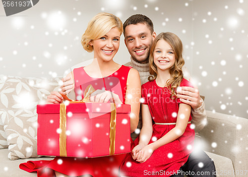 Image of happy family opening gift box