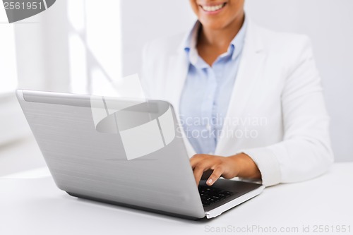 Image of businesswoman using her laptop computer