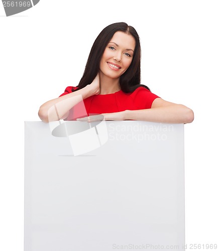 Image of smiling young woman with blank white board