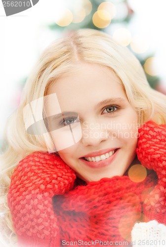 Image of smiling teenage girl in red mittens and scarf