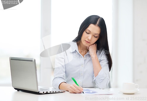 Image of tired businesswoman or student with laptop