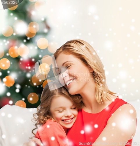 Image of hugging mother and daughter