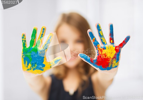 Image of girl showing painted hands