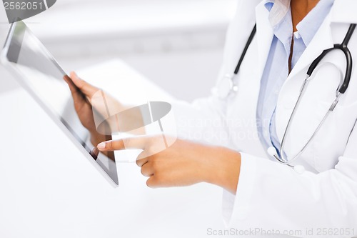 Image of female doctor working with tablet pc