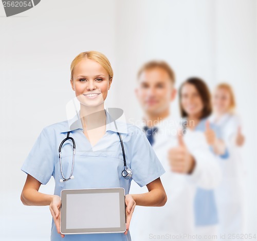 Image of smiling female doctor or nurse with tablet pc