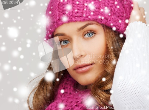 Image of woman in pink hat and scarf