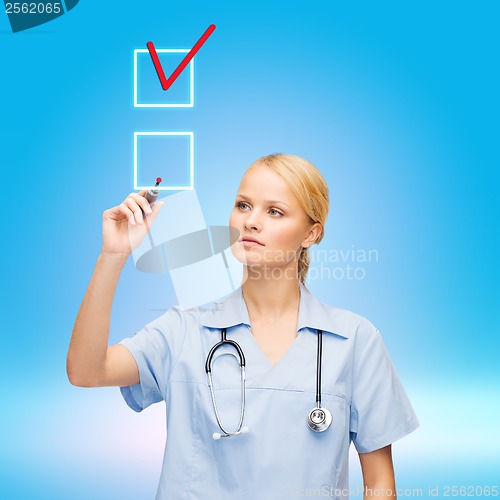 Image of doctor or nurse working with something imaginary