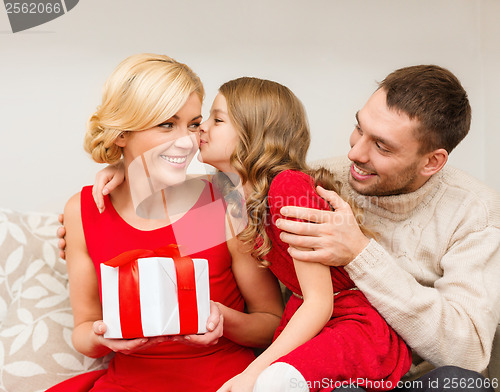 Image of adorable child kisses her mother