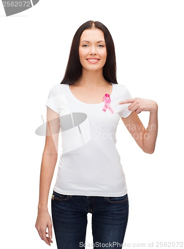 Image of smiling woman with pink cancer awareness ribbon