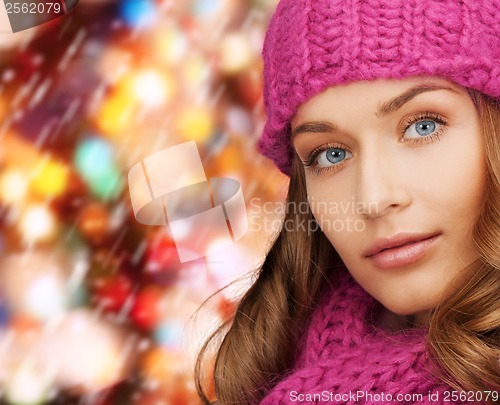 Image of woman in pink hat and scarf