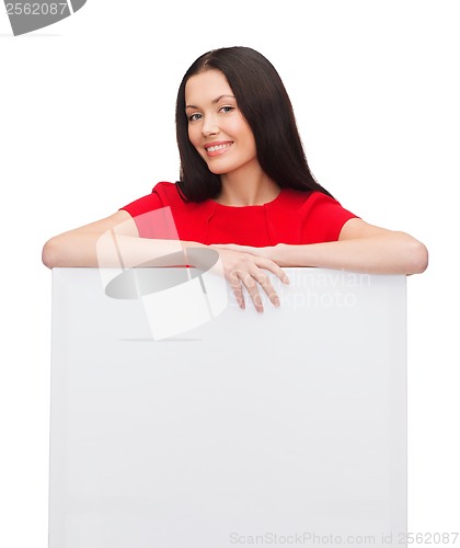 Image of smiling young woman with blank white board