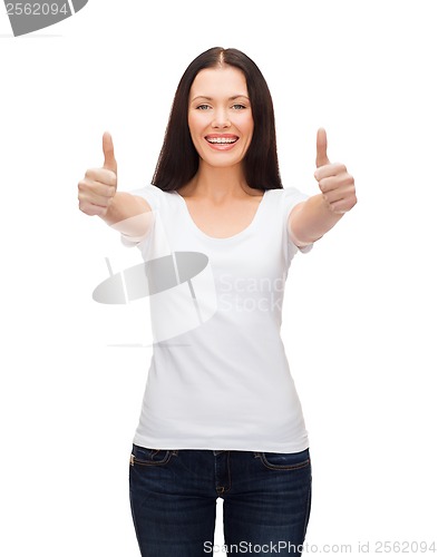 Image of smiling woman in white t-shirt showing thumbs up