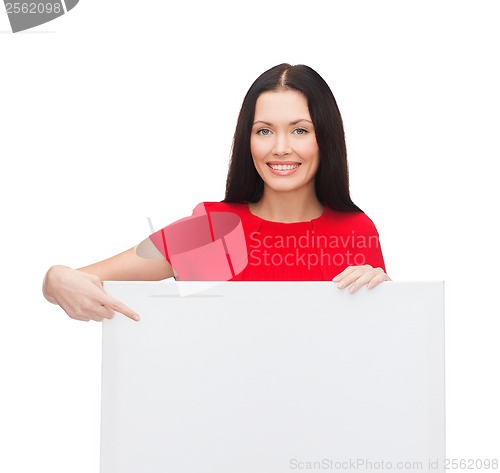 Image of smiling young woman with blank white board