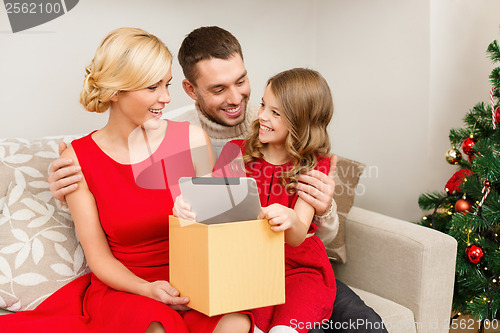 Image of smiling family with tablet pc