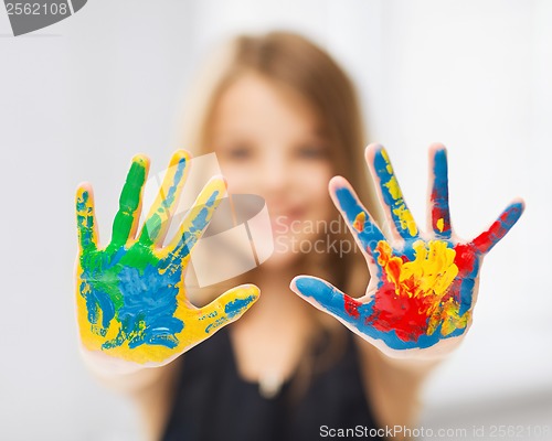 Image of girl showing painted hands