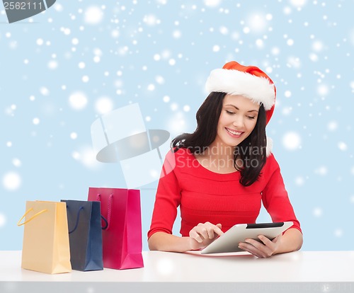 Image of woman with gift box and tablet pc computer