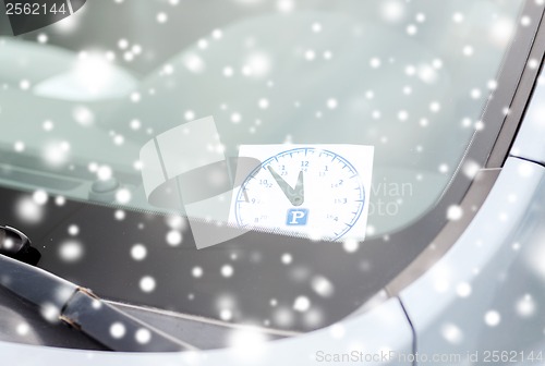 Image of parking clock on car dashboard