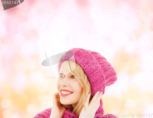 Image of woman in pink hat and scarf