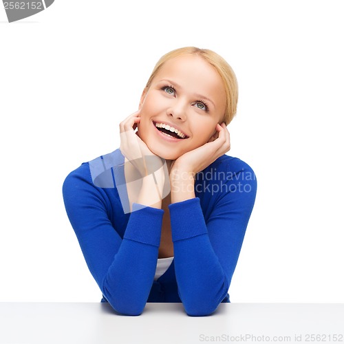 Image of happy woman dreaming and laughing