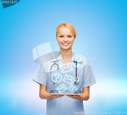 Image of smiling female doctor or nurse with tablet pc