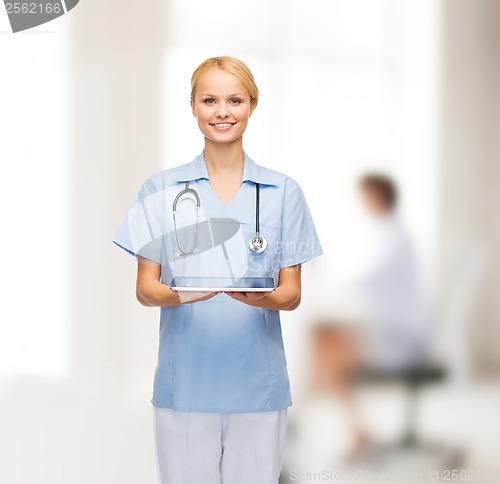 Image of smiling female doctor or nurse with tablet pc