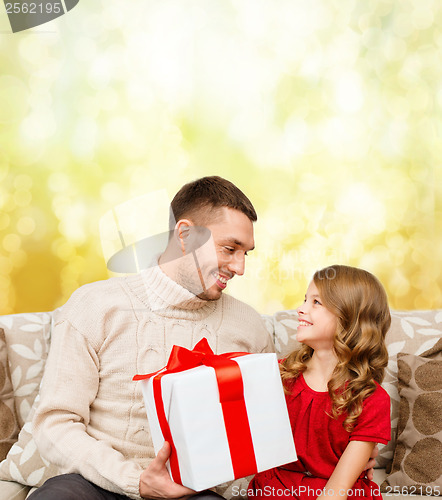 Image of smiling father and daughter looking at each other