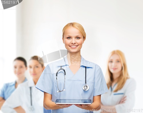 Image of smiling female doctor or nurse with tablet pc