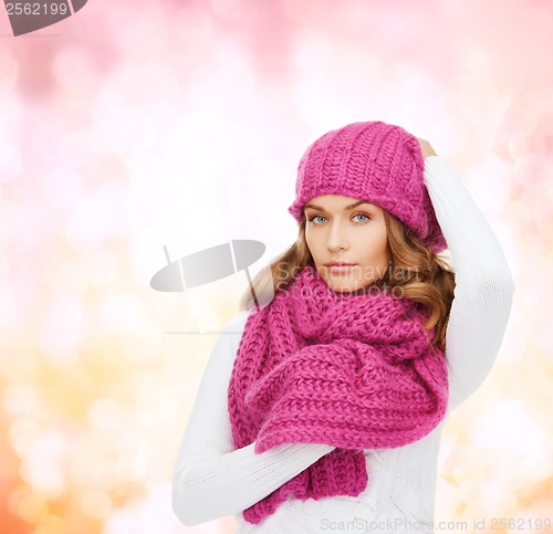 Image of woman in pink hat and scarf