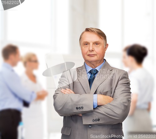 Image of serious businessman or teacher in suit