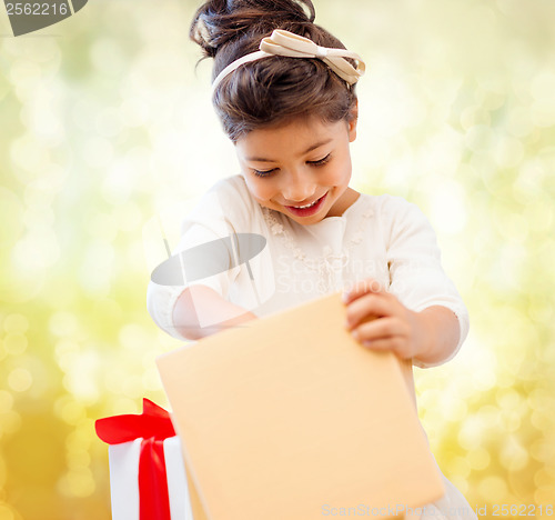 Image of happy child girl with gift box