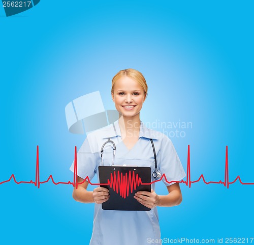 Image of smiling female doctor or nurse with clipboard