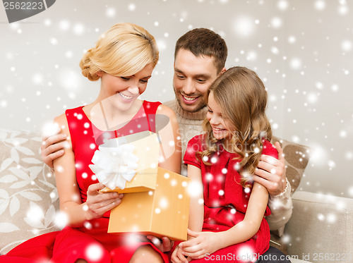 Image of happy family opening gift box