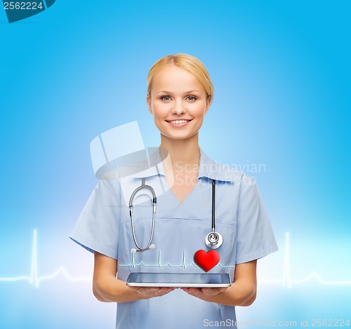 Image of smiling female doctor or nurse with tablet pc