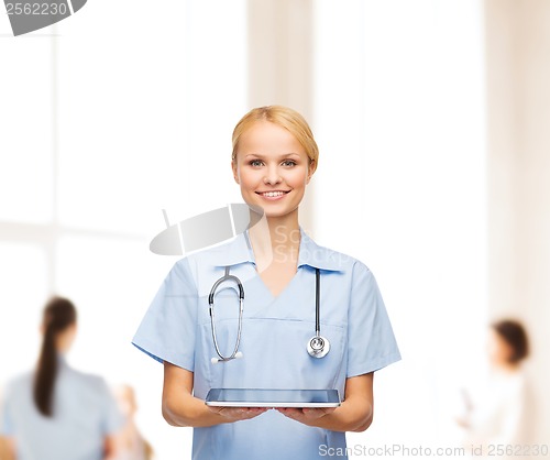 Image of smiling female doctor or nurse with tablet pc