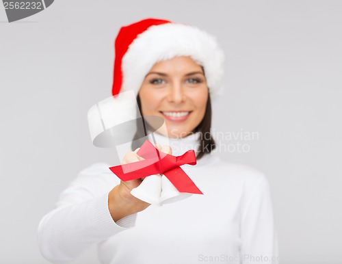 Image of woman in santa helper hat with jingle bells