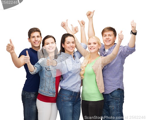 Image of group of smiling students showing thumbs up
