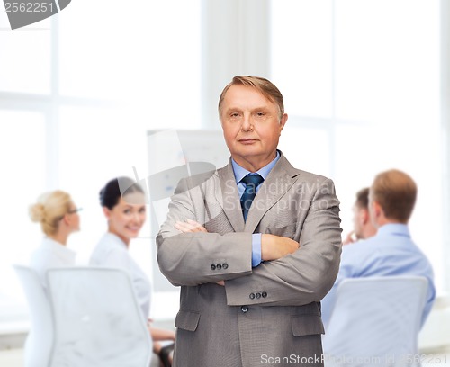 Image of serious businessman or teacher in suit