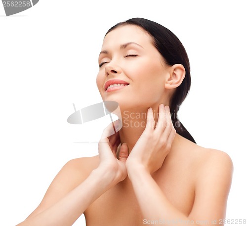 Image of smiling young woman with closed eyes