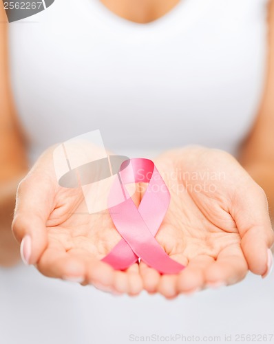 Image of hands holding pink breast cancer awareness ribbon