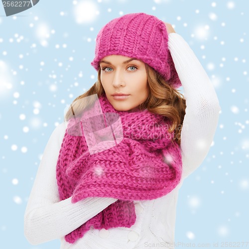 Image of woman in pink hat and scarf