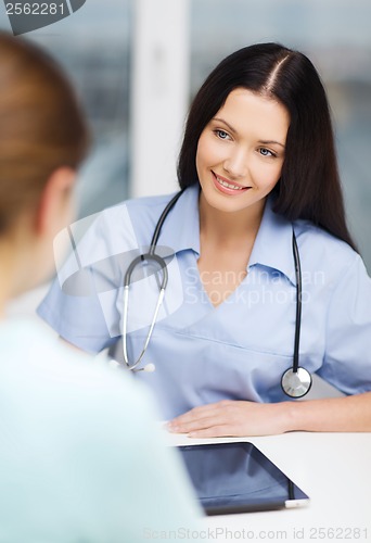 Image of female doctor or nurse with tablet pc computer