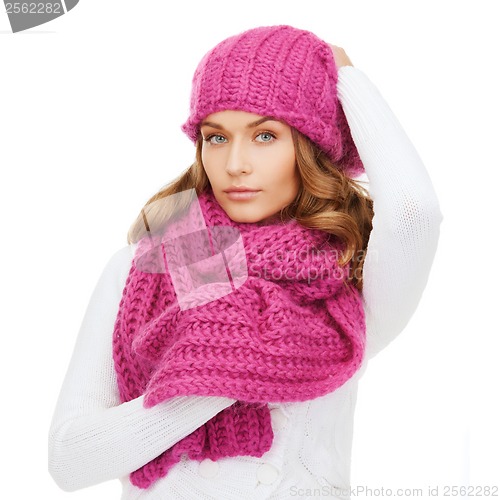 Image of woman in pink hat and scarf