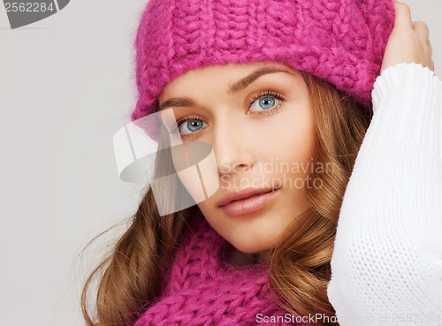 Image of woman in pink hat and scarf