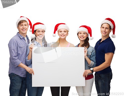 Image of group of smiling students with white blank board