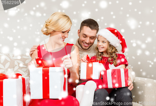 Image of happy family opening gift boxes