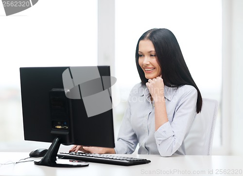 Image of smiling businesswoman or student with computer